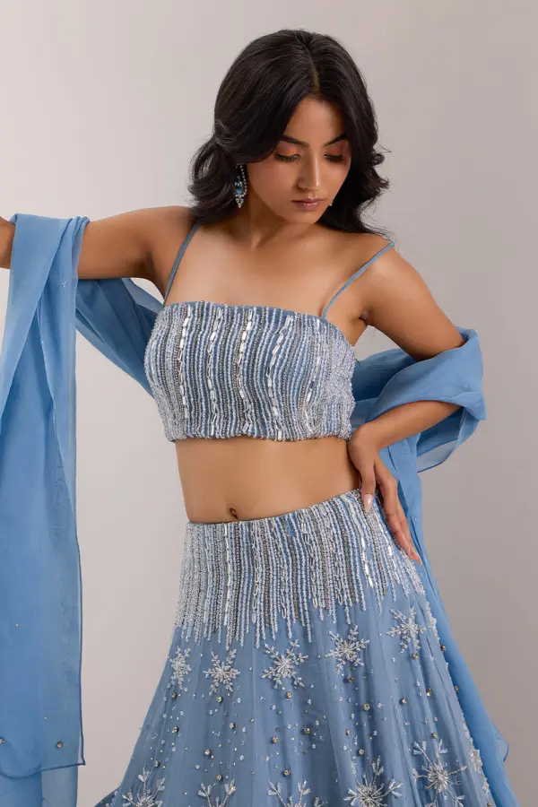 Close up of Ice Lines mix media embroidery on blue organza lehenga