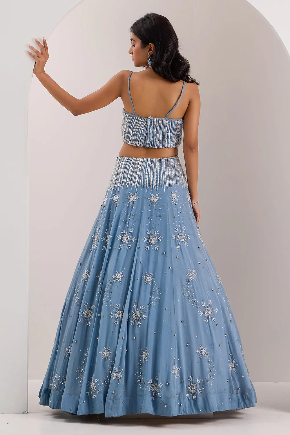 Blue Snowflake organza lehenga with tube blouse seated view