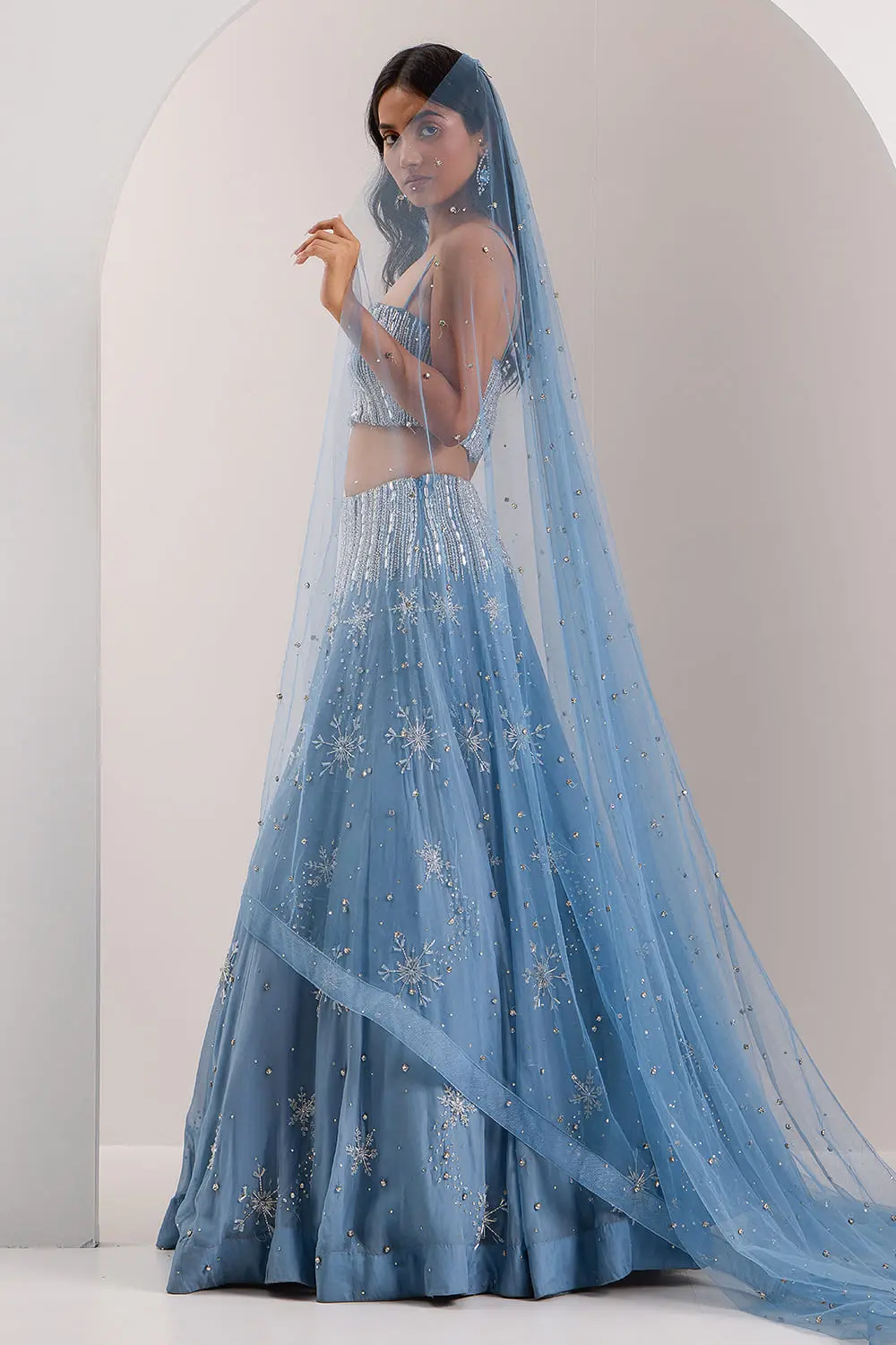Blue organza lehenga skirt hem with frosted embroidery detail