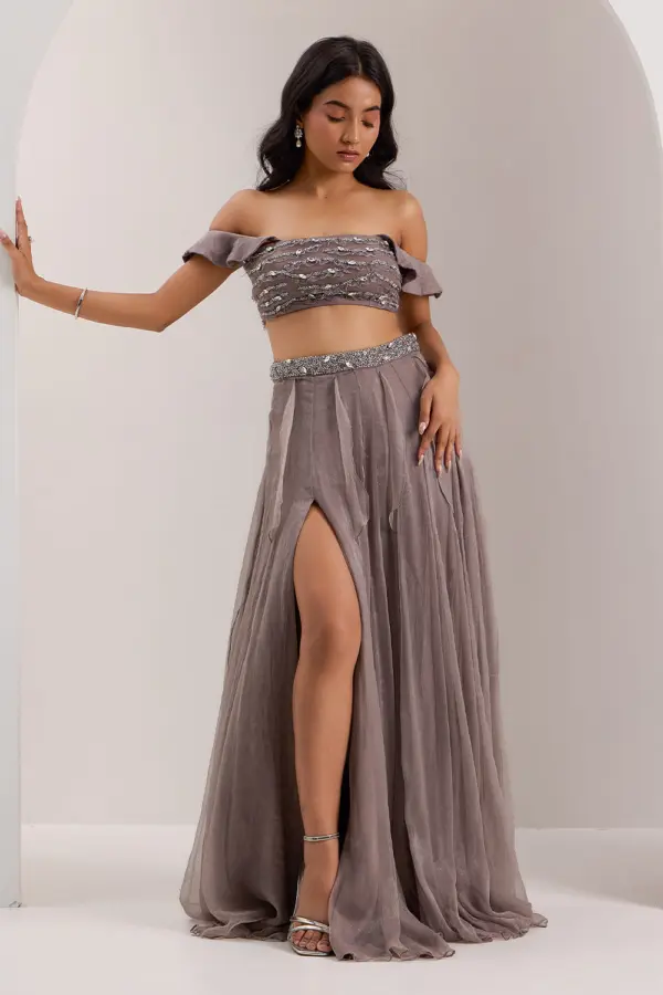 Grey off shoulder skirt set for party in shimmer chiffon with crystal work by Khaish