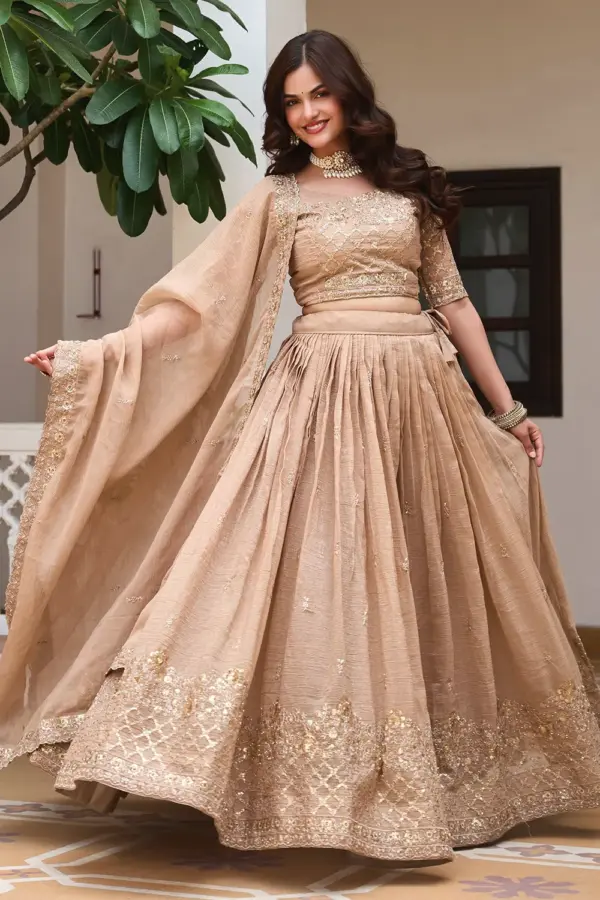 Golden beige silk lehenga choli in heavy crunchy silk with embroidery by Khaish