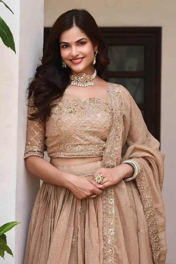 Embroidery and sequins work on golden beige crunchy silk lehenga skirt