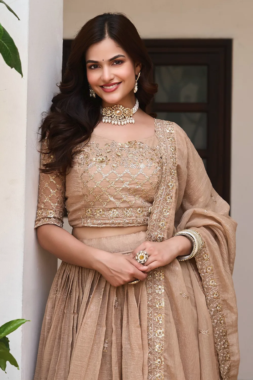 Embroidery and sequins work on golden beige crunchy silk lehenga skirt
