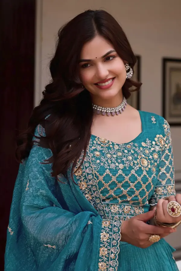 Crunchy silk blouse with embroidery and sequins work in teal blue