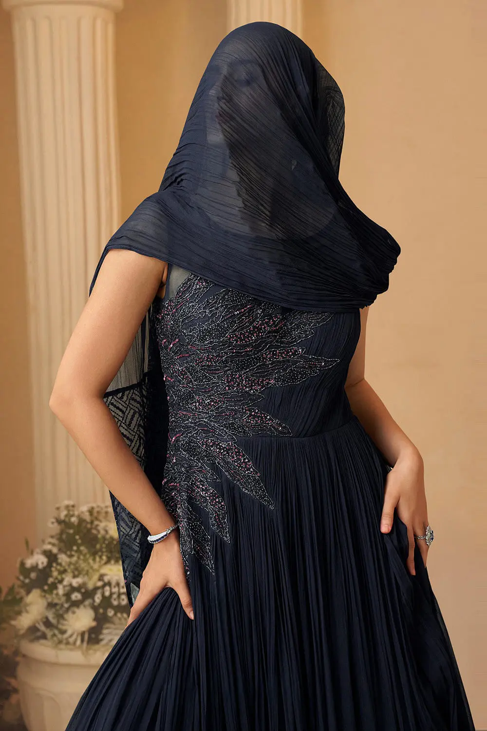 Close up of cape-style layer and embroidery on purple wedding gown