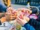 people holding clear drinking glasses