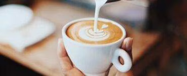 person making latte art