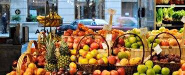 a bunch of baskets filled with different types of fruit