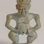 Pendente in faience a forma di divinità egizio. Da tomba 164 S. Marzano- Polo Museale della Campania- Museo archeologico valle del Sarno1