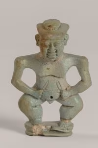Pendente in faience a forma di divinità egizio. Da tomba 164 S. Marzano- Polo Museale della Campania- Museo archeologico valle del Sarno1