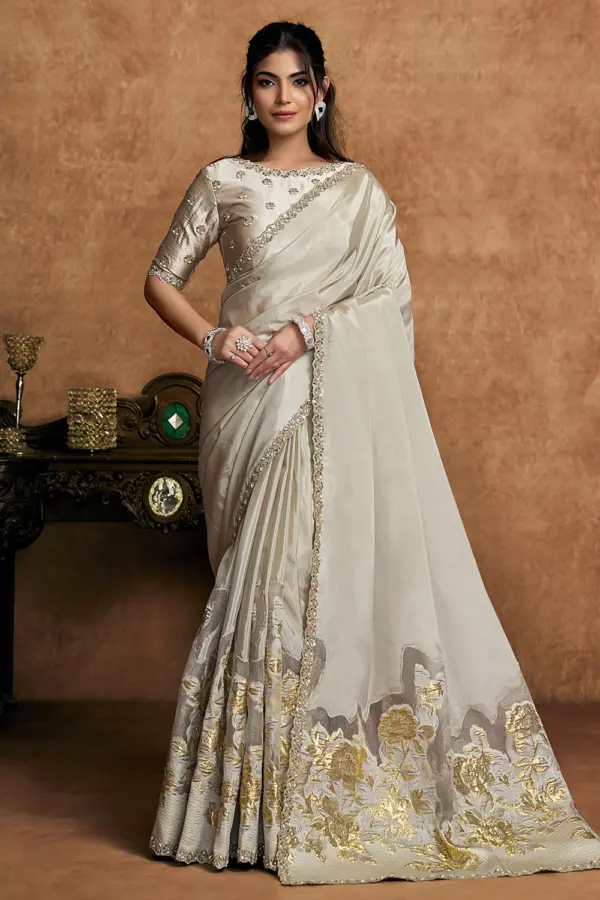 Front view of Champagne Ivory Crepe Silk Saree showcasing sequin embroidery and pearl detailing