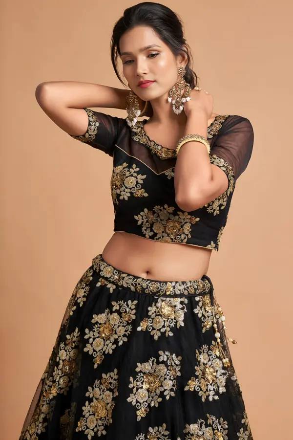 Close-up shot of zari and multi-sequin work on Black Soft Net Lehenga skirt.
