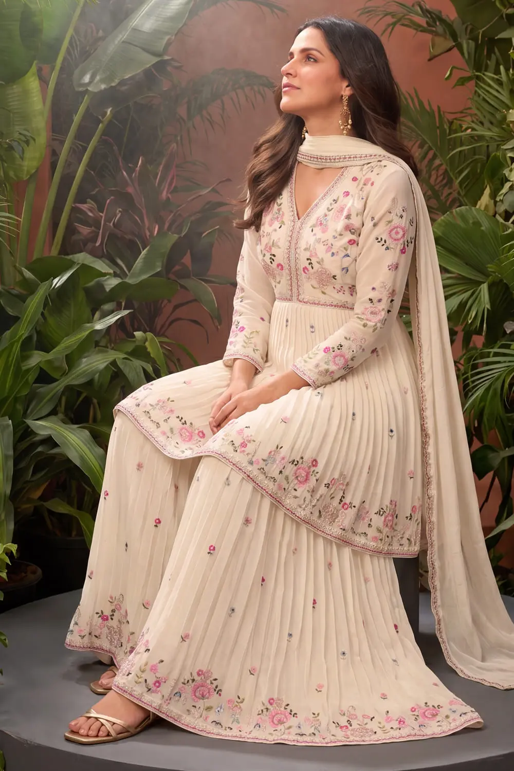 Close up of premium embroidery on ivory chinon kurta
