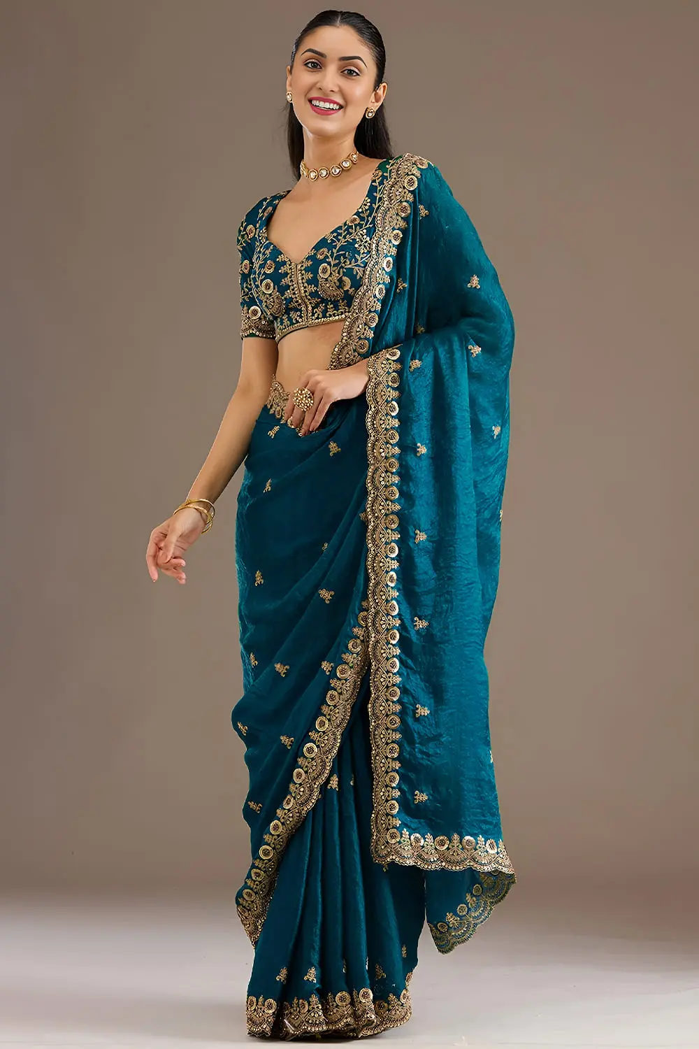 Side view of dove blue tissue silk saree with sequins work