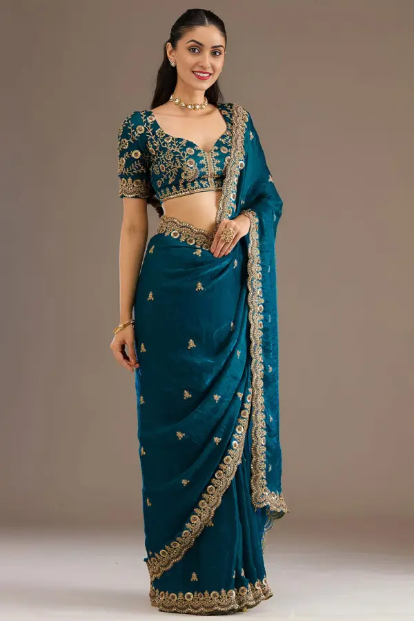 Dove blue tissue silk saree with sequins and zari work by Khaish