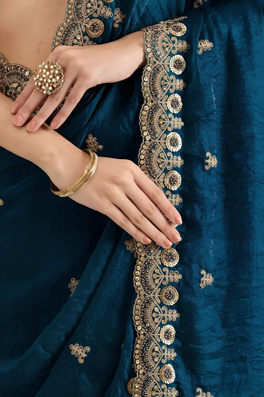 Embroidered border detail on dove blue tissue silk saree