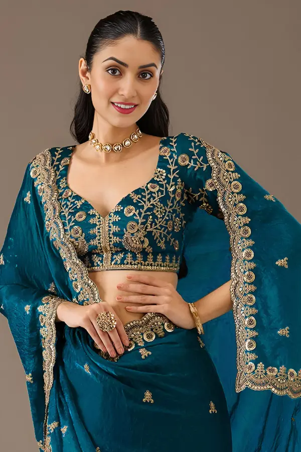 Close up of sequins, zari, diamond and pearl work on dove blue saree