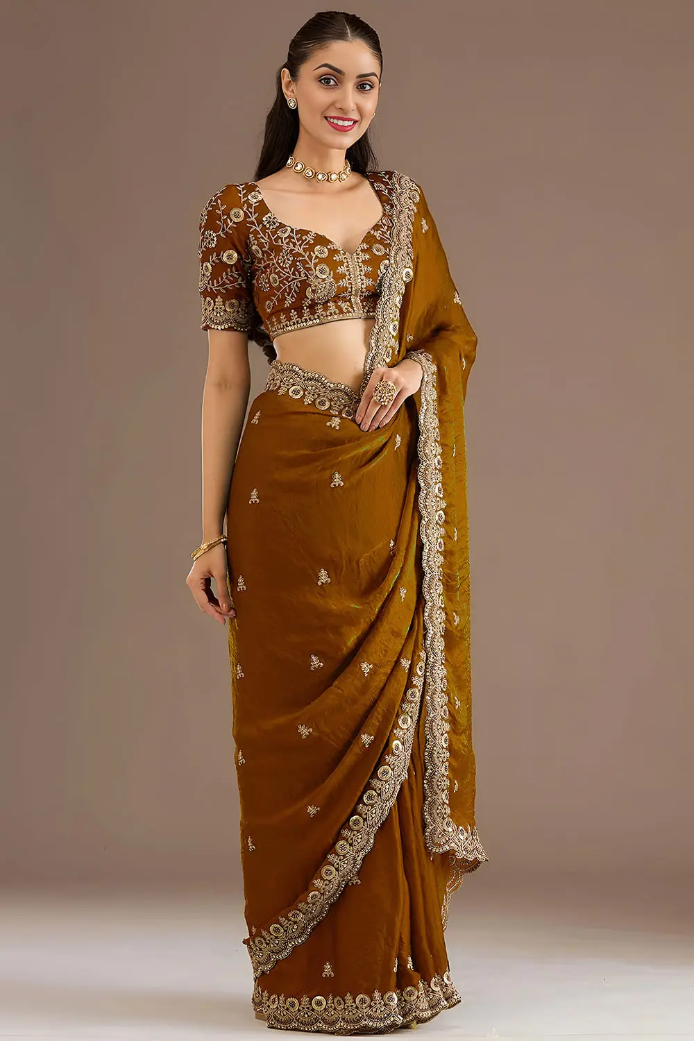 Side view of gold tissue silk saree with sequins work