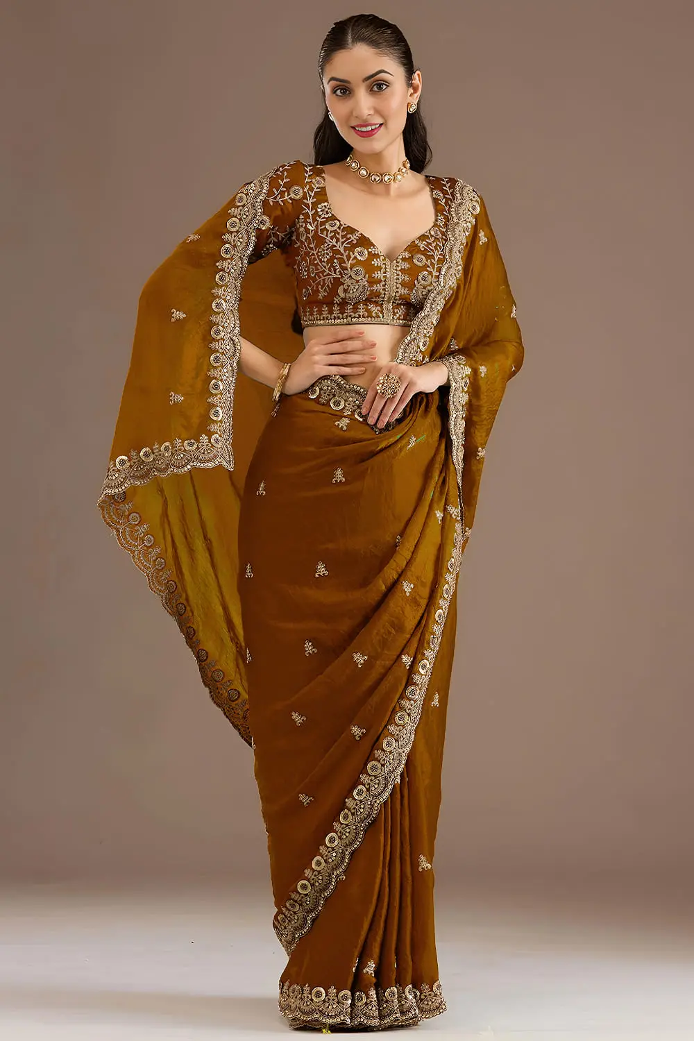 Radiant gold tissue silk saree draped full view