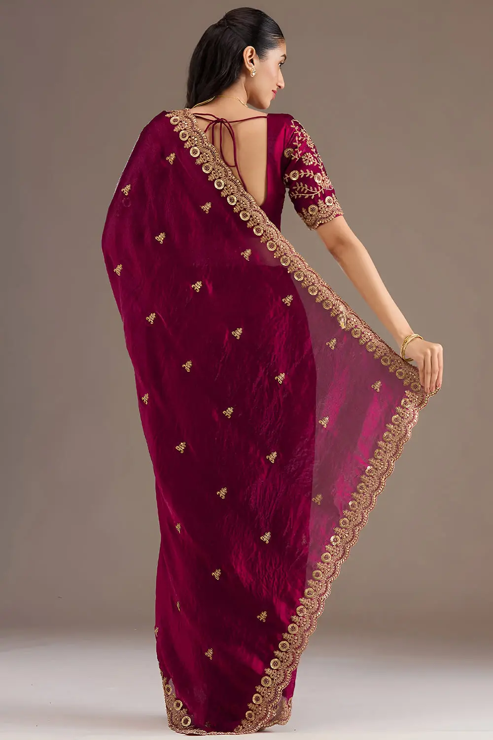 Back view of maroon tissue silk saree with embroidery