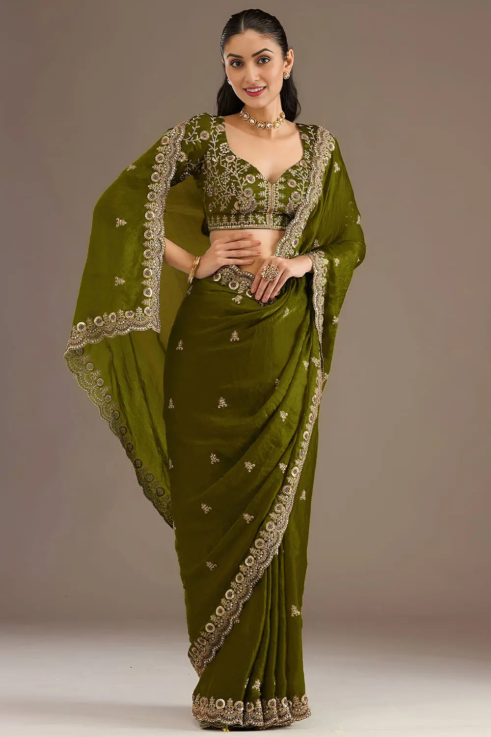 Side view of olive green tissue silk saree with sequins work