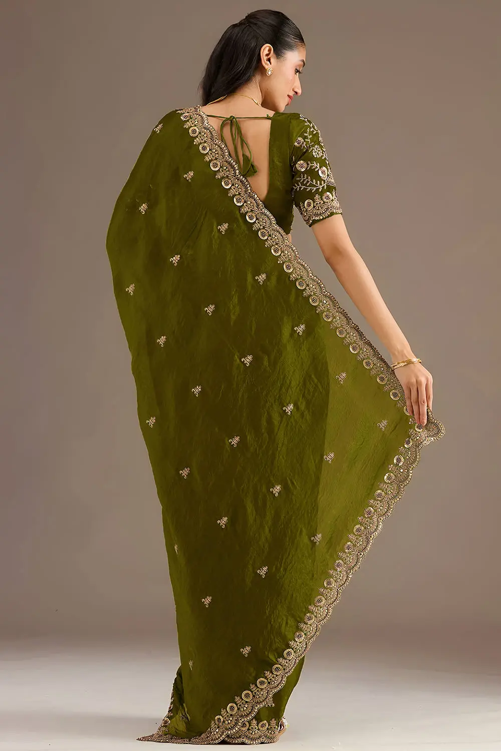 Back view of olive green tissue silk saree with embroidery
