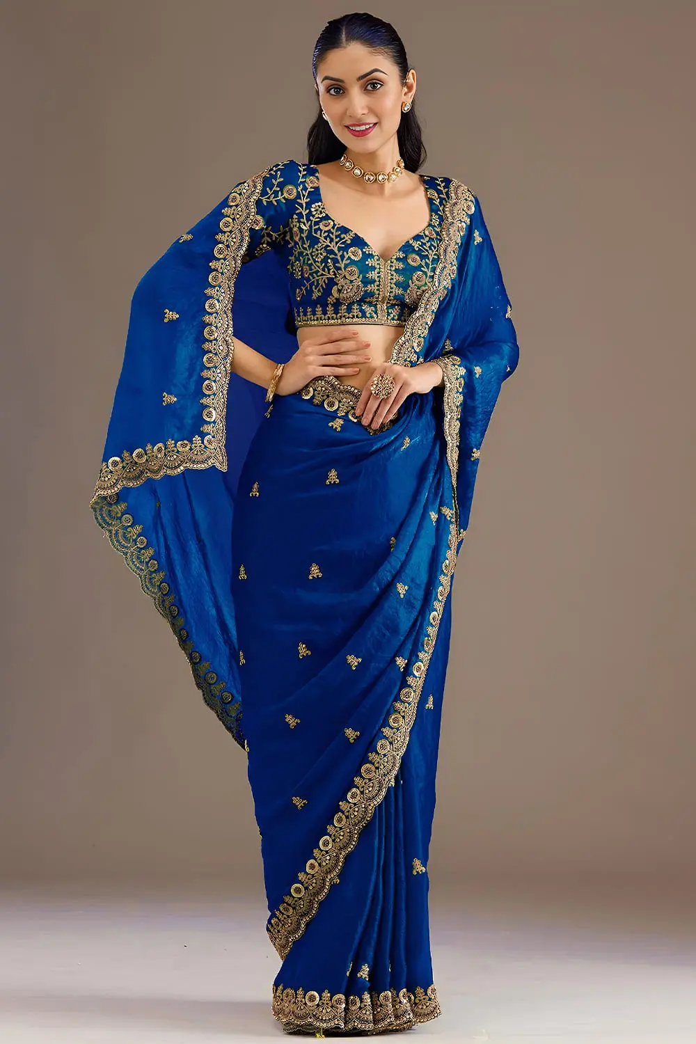 Side view of royal blue tissue silk saree with sequins work