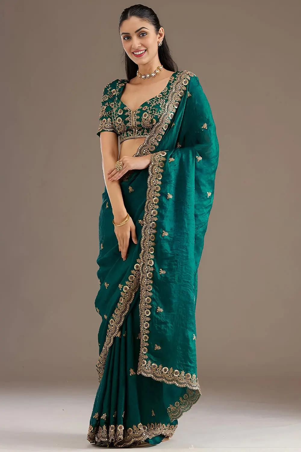 Vibrant rama green tissue silk saree draped full view