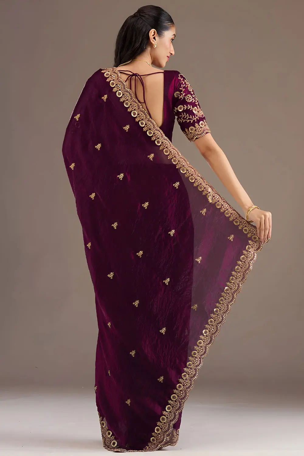 Back view of wine tissue silk saree with embroidery