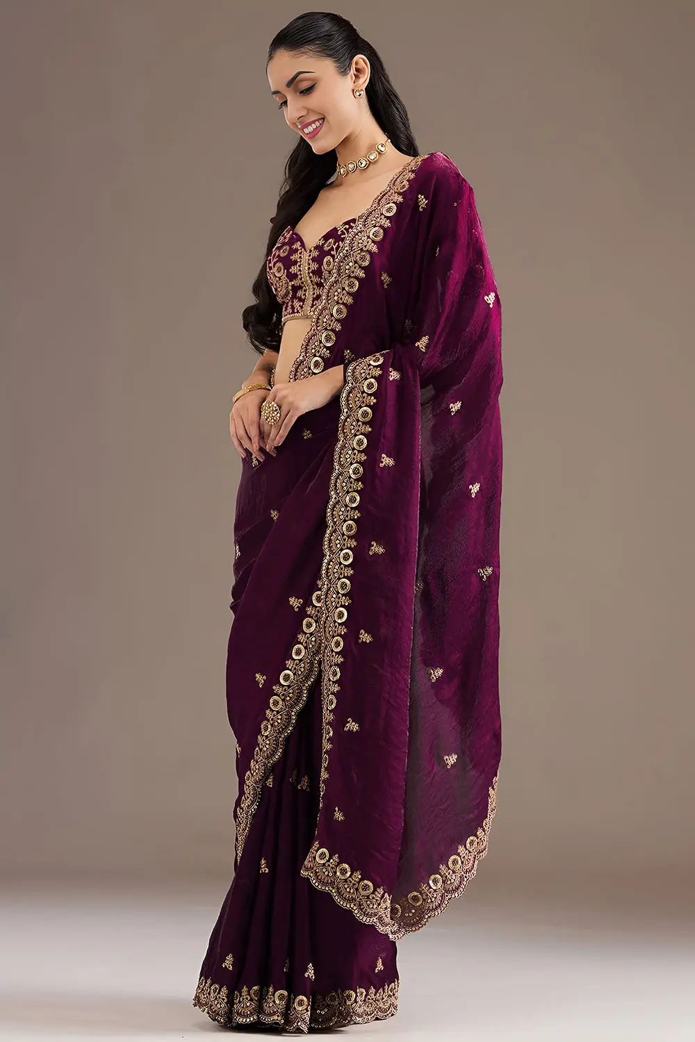 Side view of wine tissue silk saree with sequins work