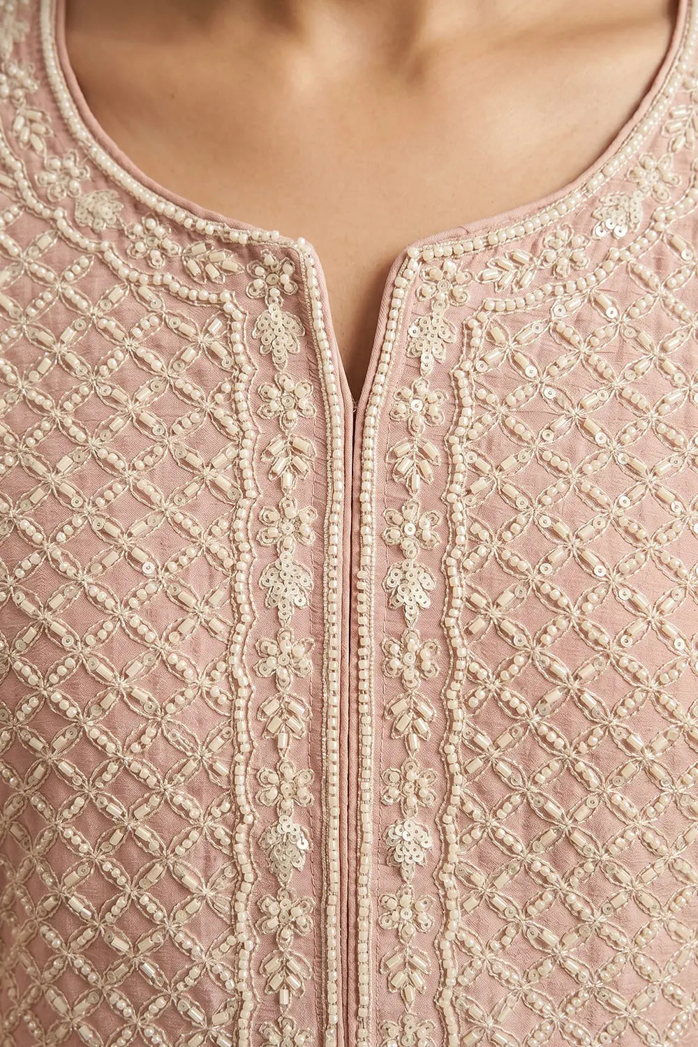 Close up of heavy beads work on dusty pink chinon silk kurta