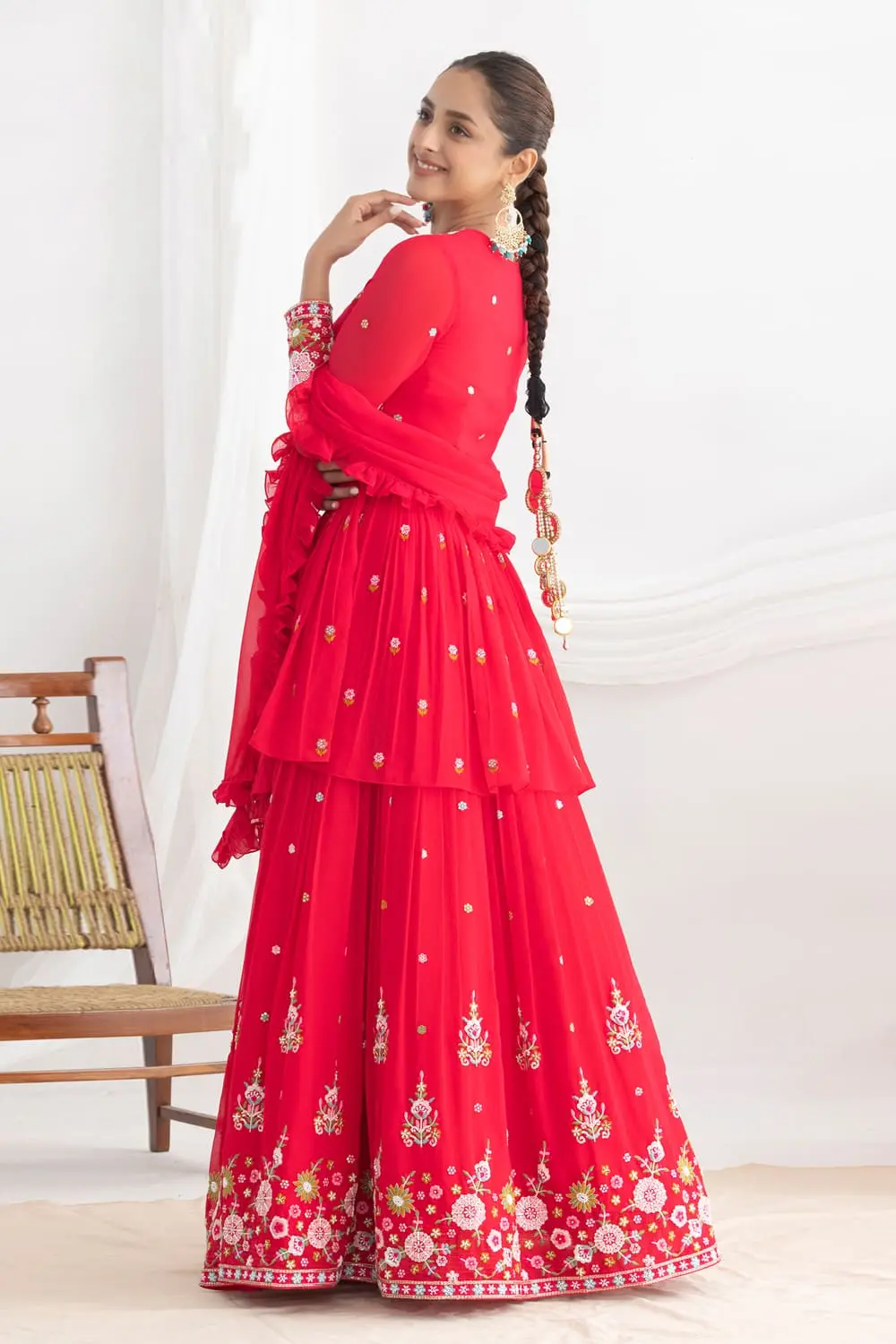 Close up of beadwork and silk work on pink georgette lehenga set
