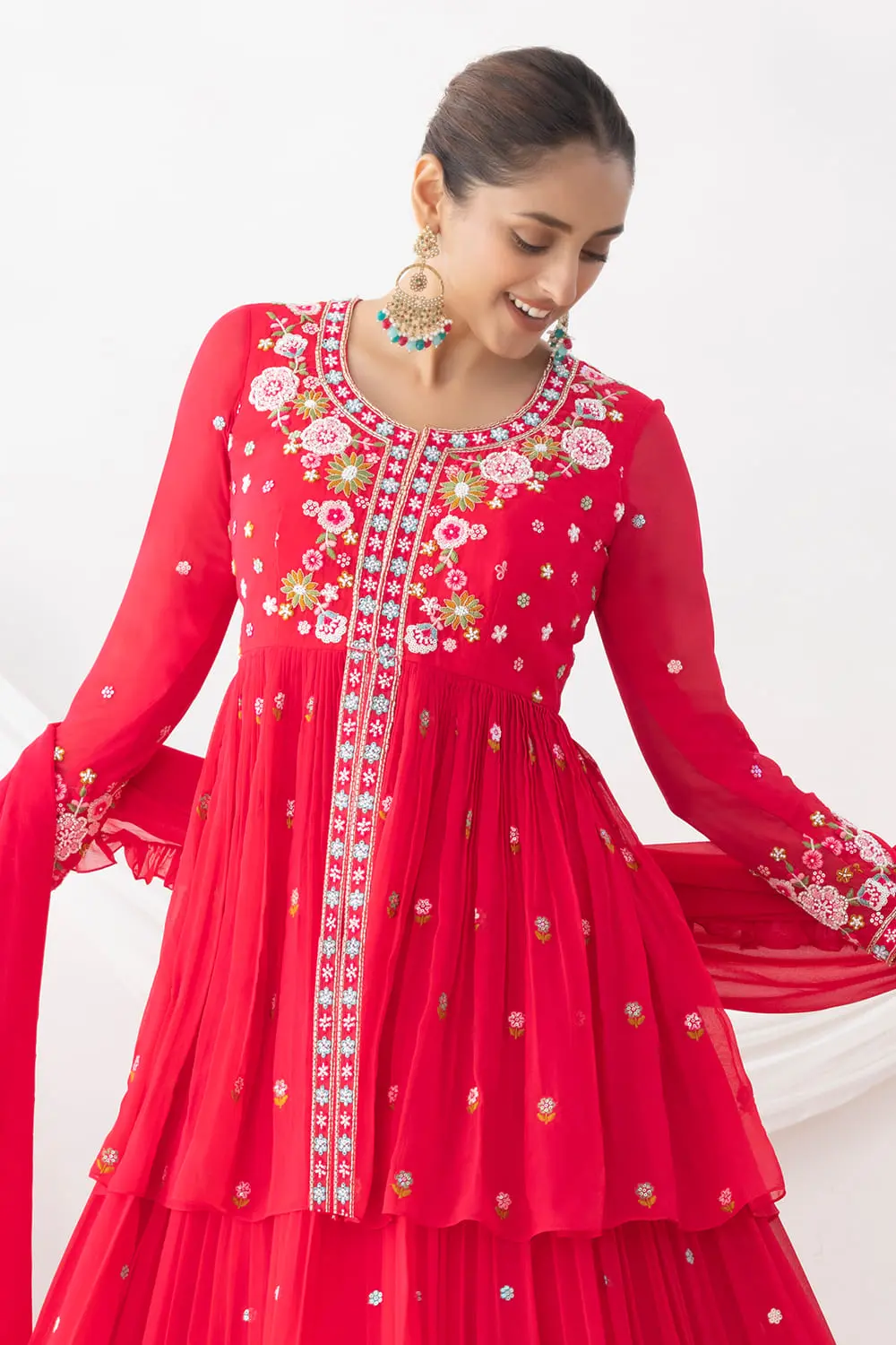 Elegant neckline with floral silk and beadwork on pink georgette top