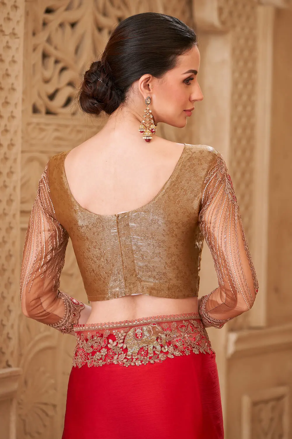 Embroidery work and tassel lace detail on red satin silk saree