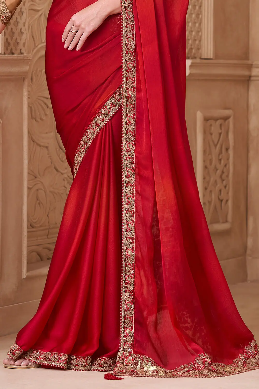 Lustrous red satin silk saree pallu with embroidery detailing