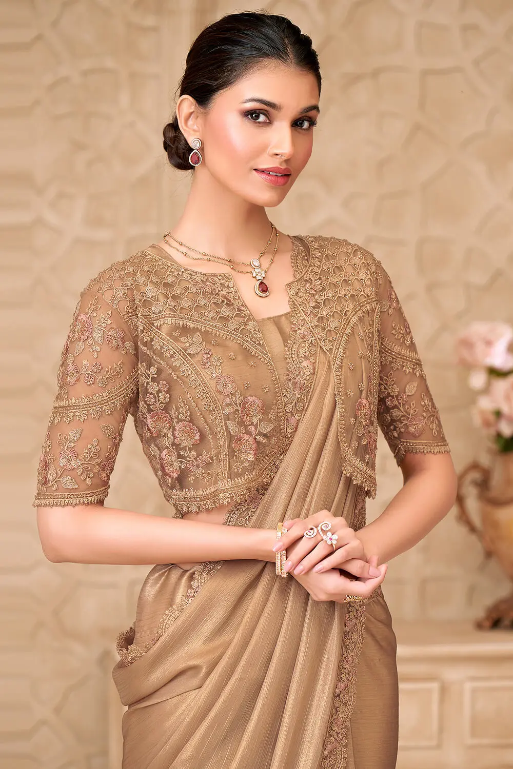 Shimmer satin georgette saree draped elegantly with jacket blouse