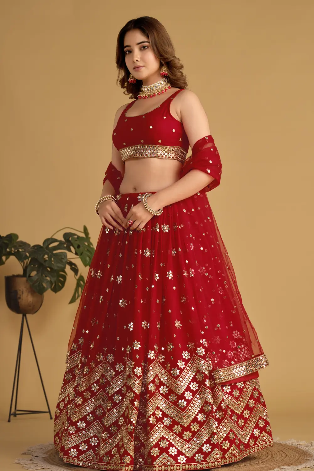 Red georgette lehenga styled with soft net blouse and net dupatta