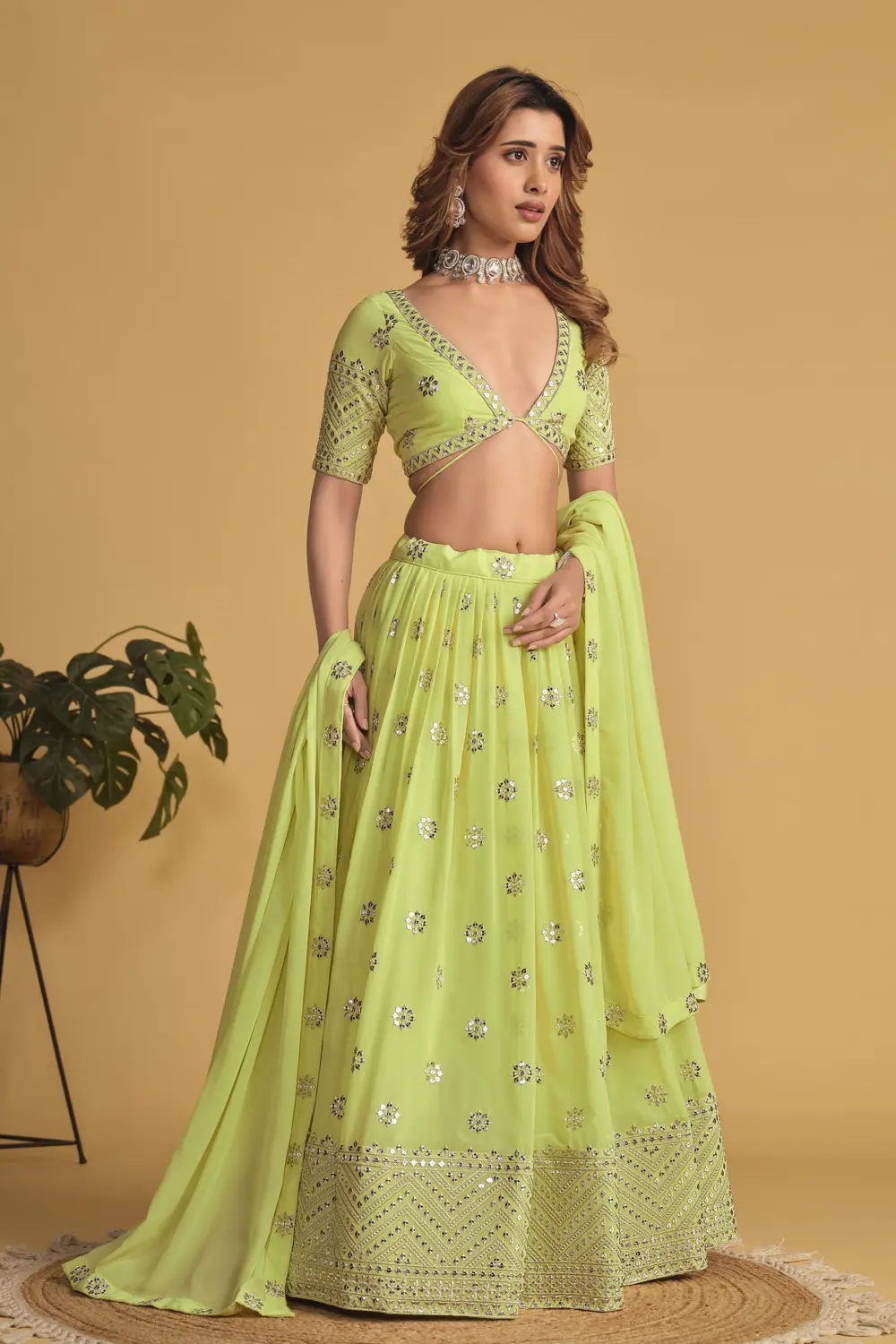 Neon georgette lehenga styled with matching blouse and georgette dupatta