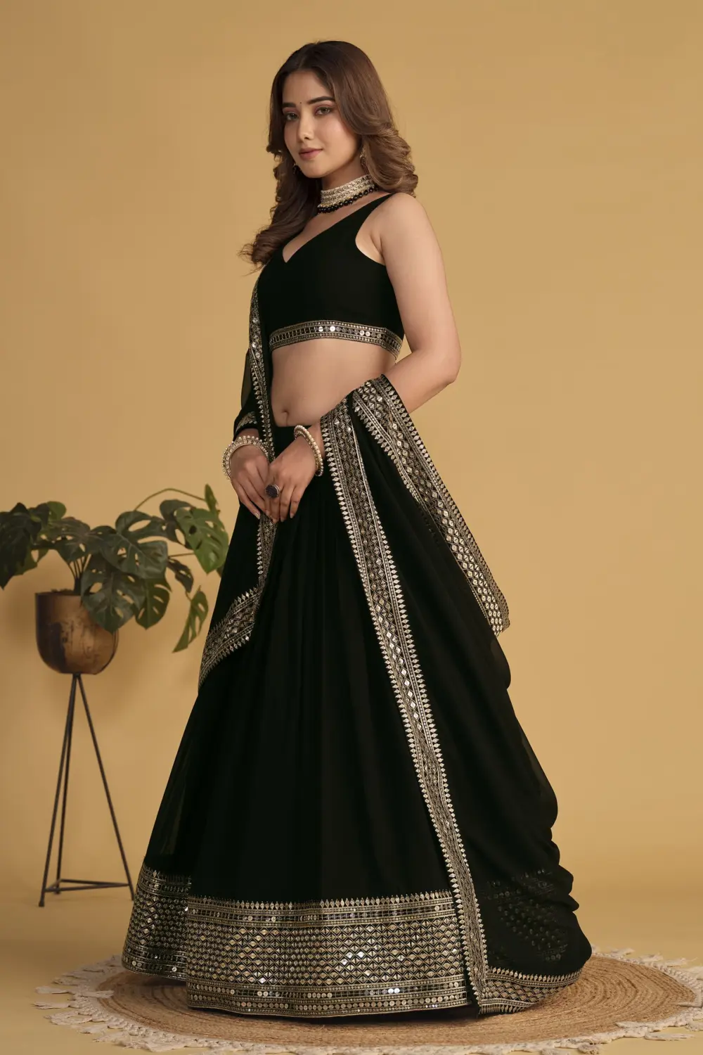 Black georgette lehenga styled with matching blouse and georgette dupatta