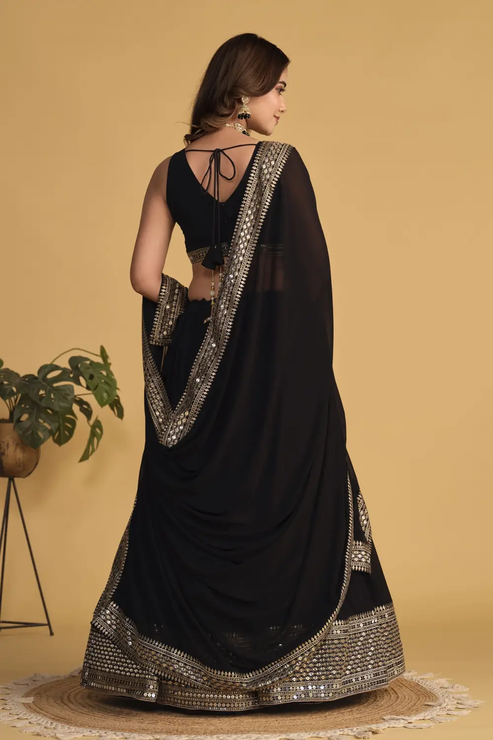 Back view of black georgette lehenga choli with sequins detailing