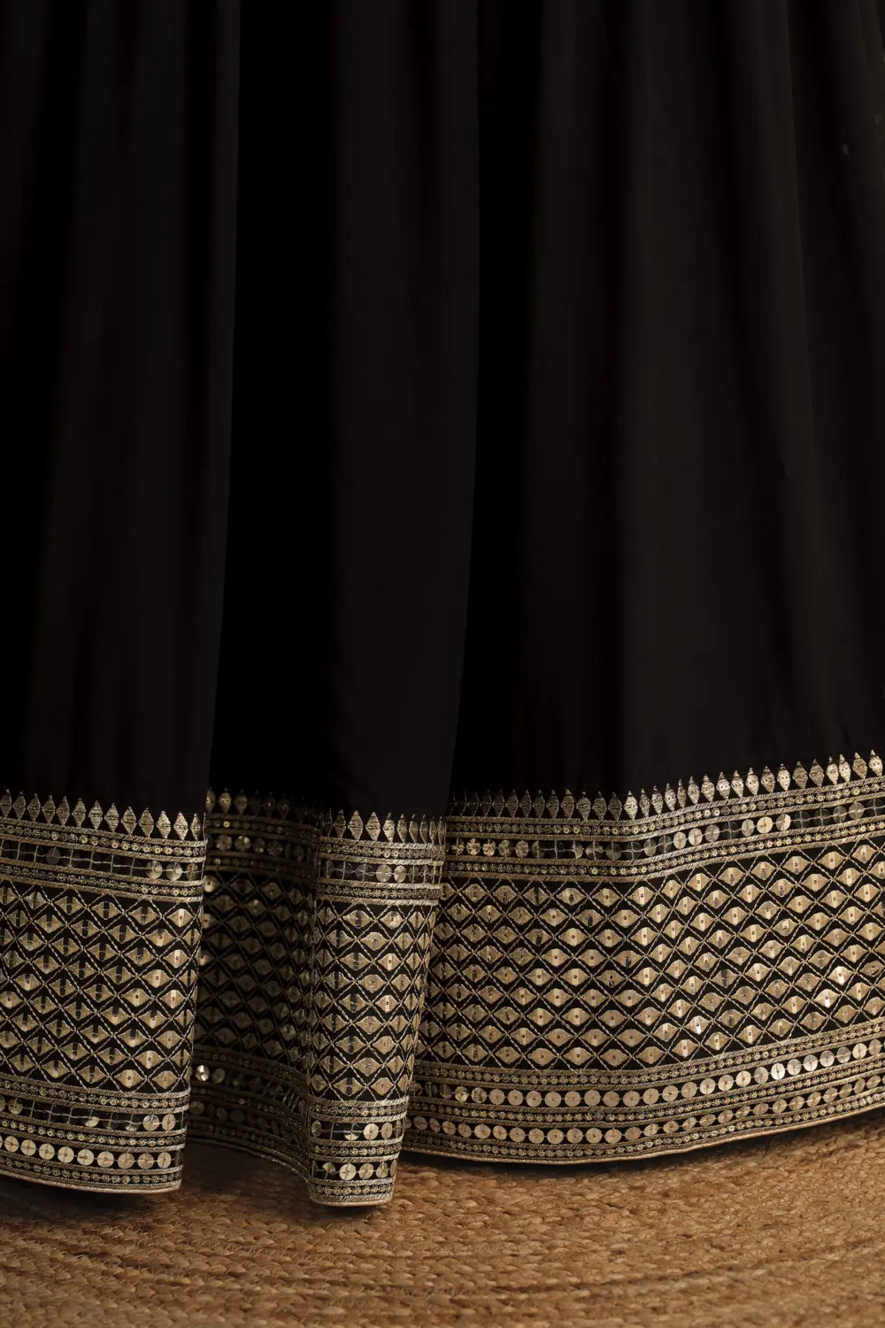 Close up of sequins and zari work on black georgette lehenga