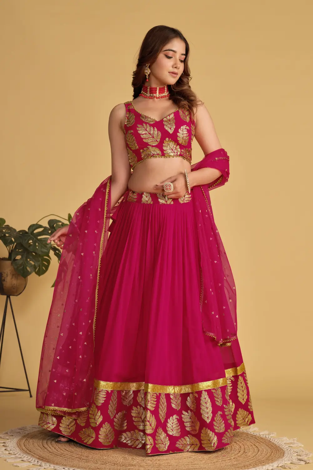 Close up of sequins and zari work on pink georgette lehenga