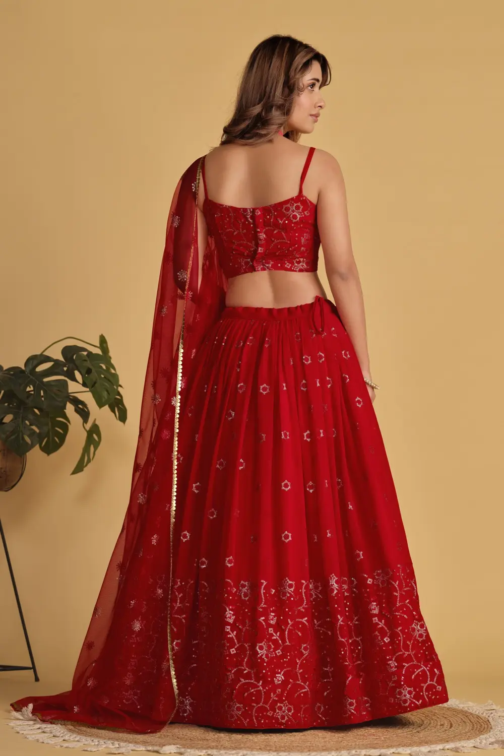 Back view of red georgette lehenga choli with soft net dupatta
