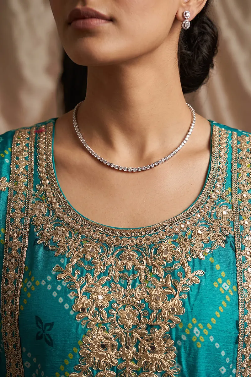 Close up of heavy embroidery and mirror work on teal purple ombre kurta top