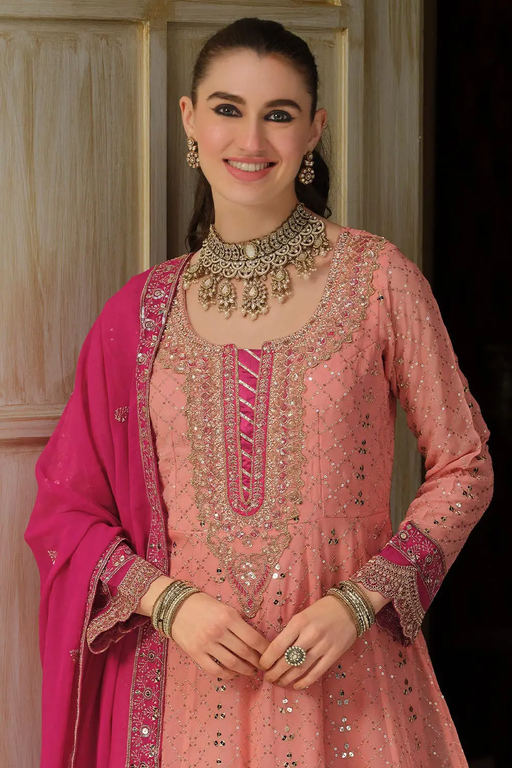 Close up of embroidery on peach georgette anarkali gown