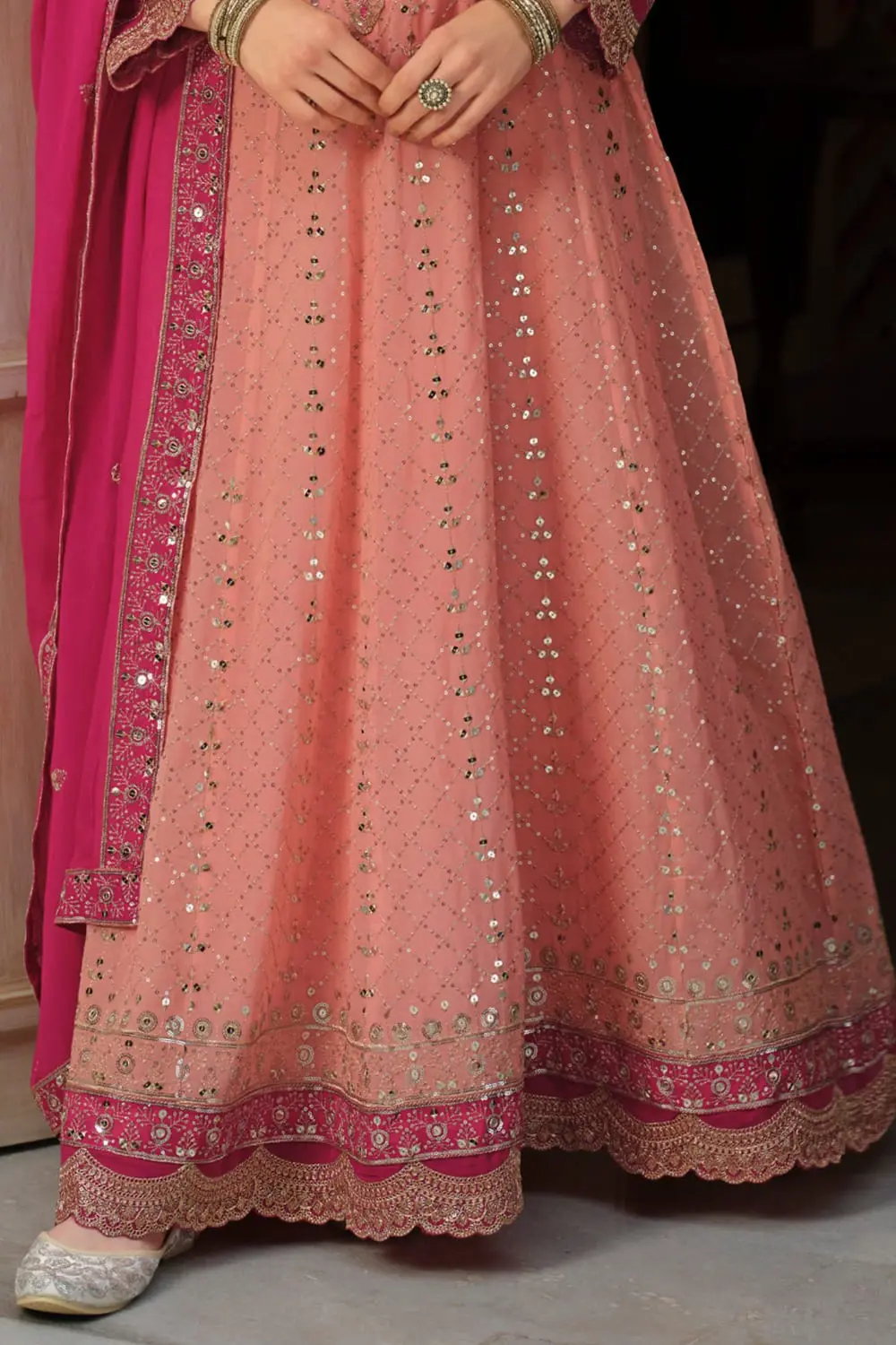 Bottom flare of peach georgette anarkali gown