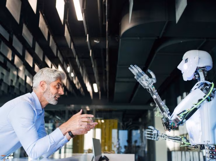 Illustrazione di una persona e di un robot (Canva FOTO) - systemscue.it